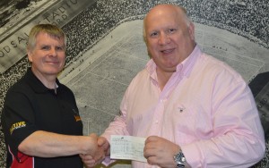 Mark Hobson of Hamtune Spares & BCB commentary team, hands over sponsorship cheque