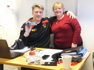 Head of youth, John Bastian, receives camcorder from BullBuilder board member, Jen Bennison.